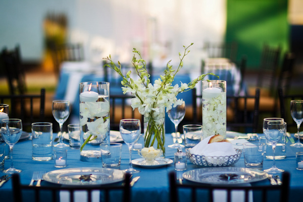 reception seating decor - aqua tablecloth with white floral centerpieces - photo by Washington DC based wedding photographers Holland Photo Arts